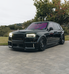 Black Rolls-Royce Cullinan with the Urban Series 1.5 Widetrack program, front three-quarter view