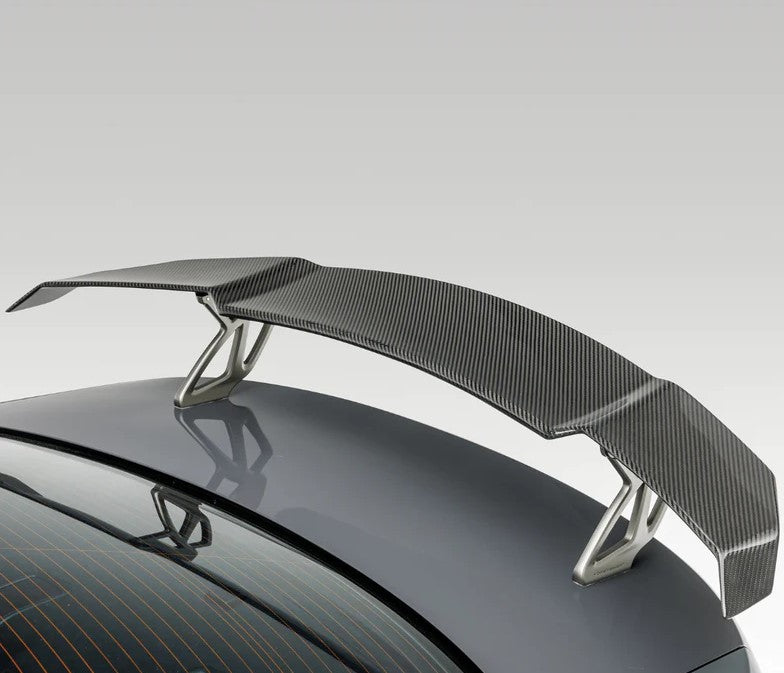 A back view of Vorsteiner VRS BMW G87 M2 Aero Wing Blade w/ Aluminum Uprights Carbon Fiber PP 2x2 Glossy fitted on a car