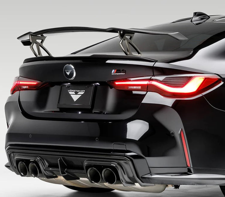 A back view of Vorsteiner VRS BMW G87 M2 Aero Wing Blade w/ Aluminum Uprights Carbon Fiber PP 2x2 Glossy fitted on a black car