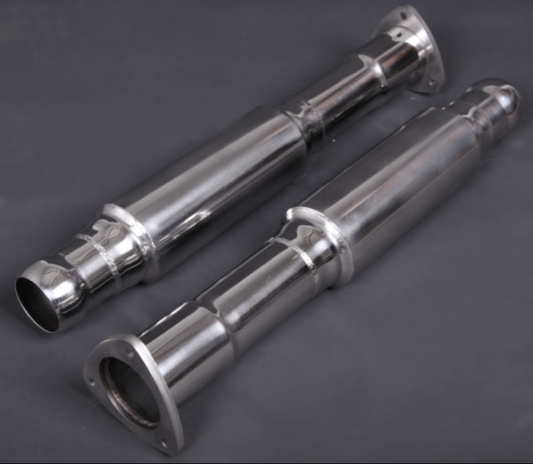 wide view of Capristo Dampened Secondary Cat Delete Pipes for Aston Martin V12 Vantage 2022+ with black background