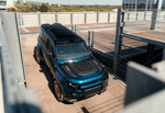 Overhead view of the Urban Widetrack Defender OCTA showing the forged carbon bonnet