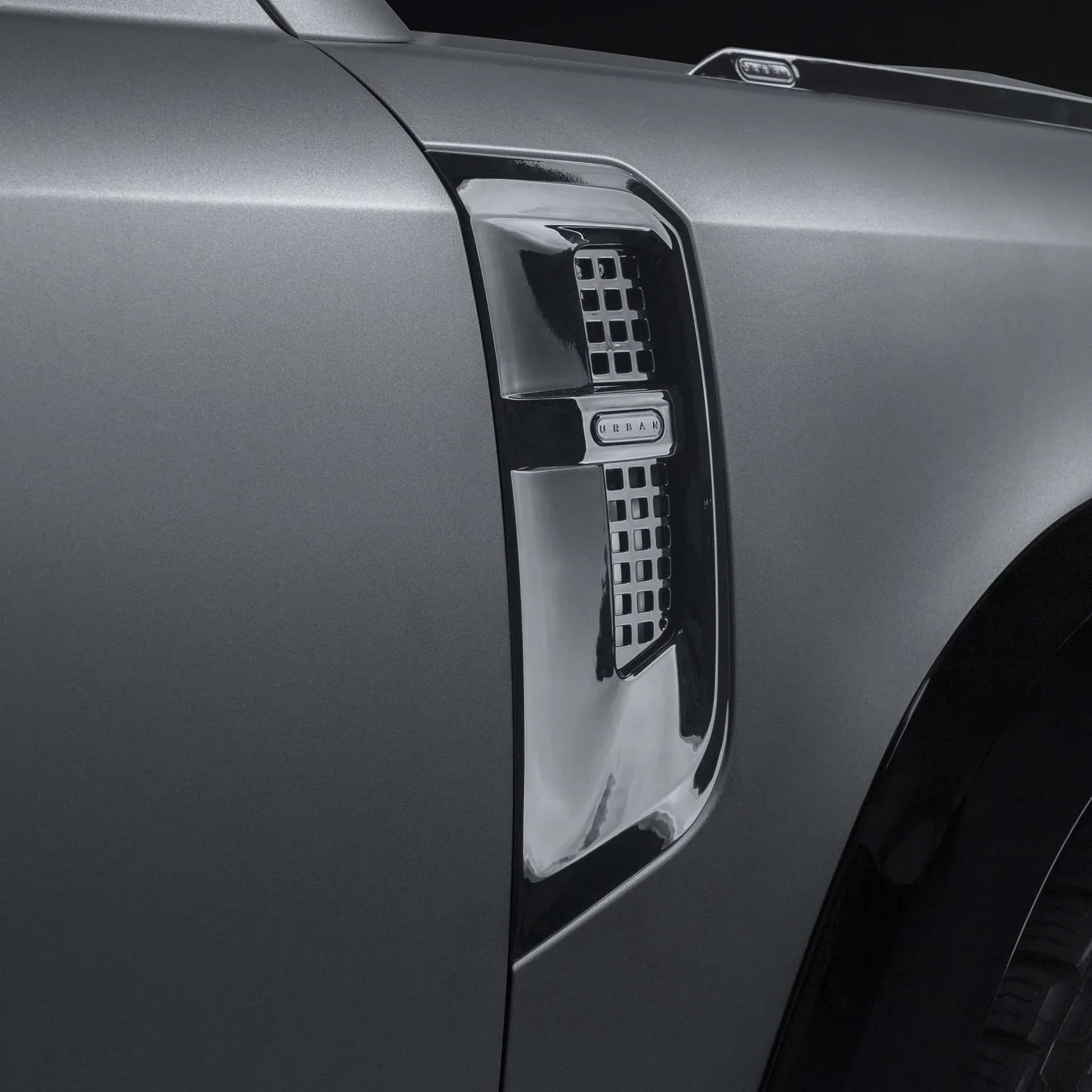 Urban Best of British side vent on the front fender of a grey Land Rover Defender