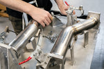 Soul Gallardo LP560 cat bypass pipes: technician fitting a bypass exhaust