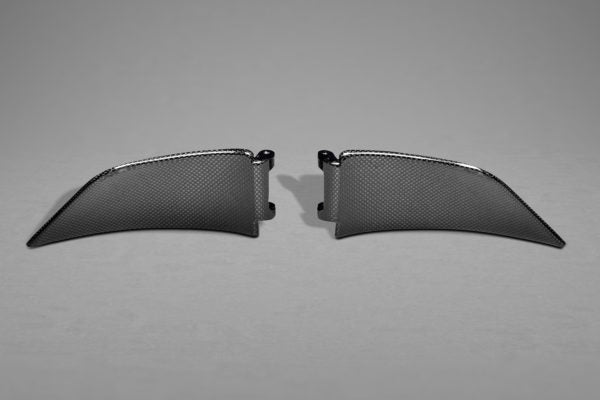 close view of Capristo Carbon Air Intake Flaps (Matte) for Ferrari 458 Speciale  2013-2015 with a grey background