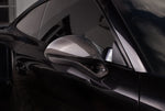 A close up view of TECHART Side Mirror Kit (L/R) Carbon "glossy" Sport Design for Porsche 991 / 981