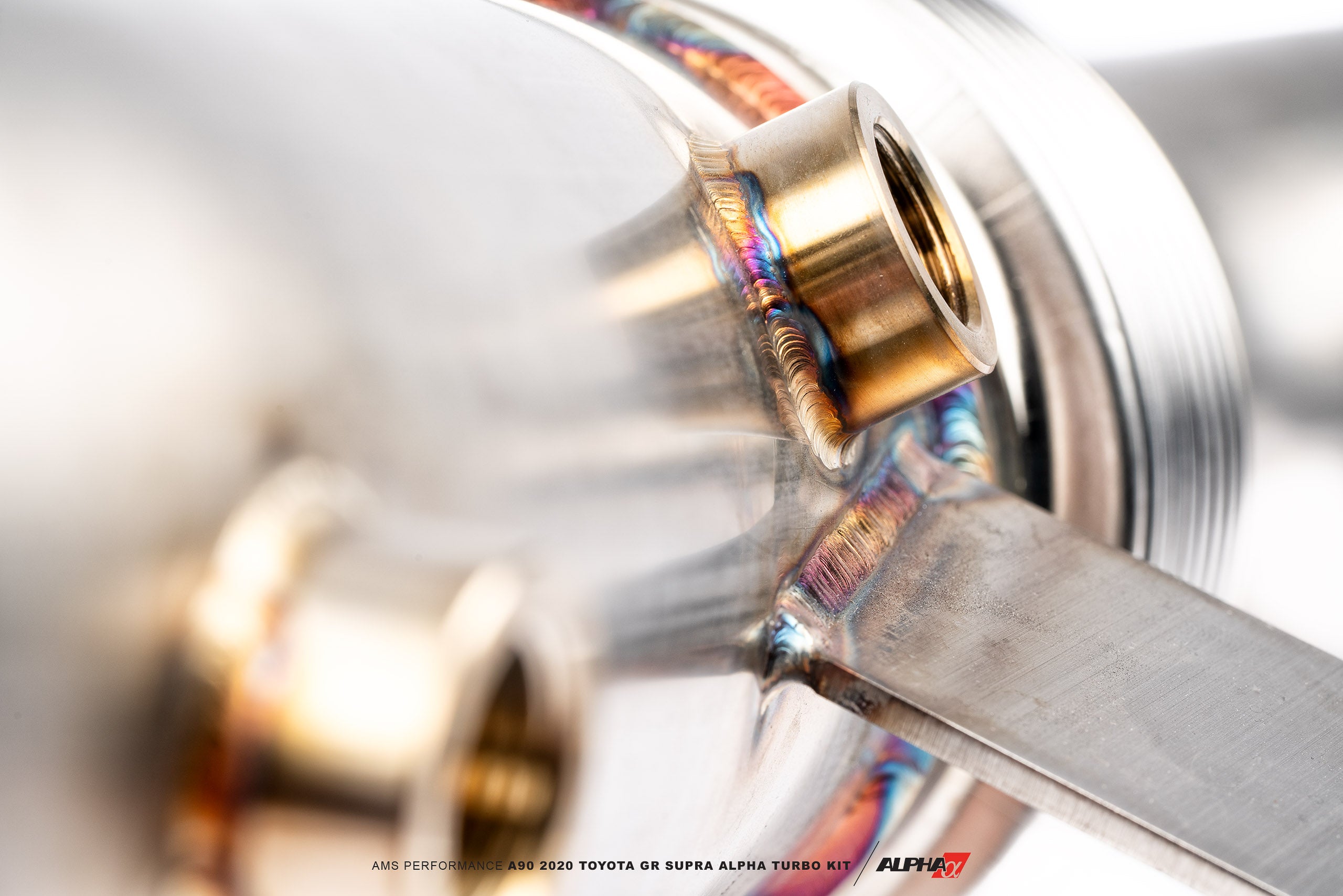 Close-up of welds on the AMS Alpha 8 Supra downpipe