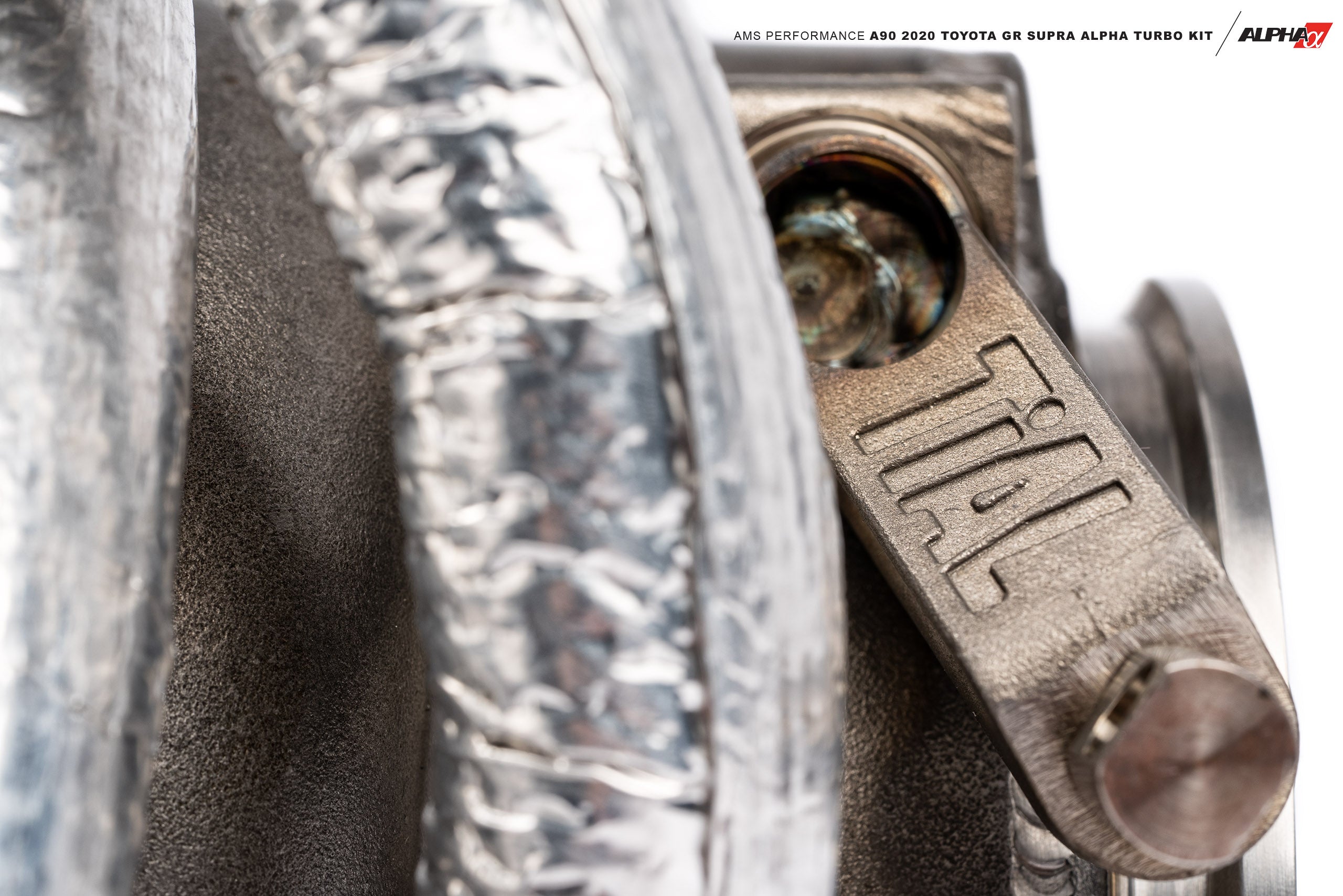 TiAL exhaust housing and line sheath on the AMS GR Supra turbo kit