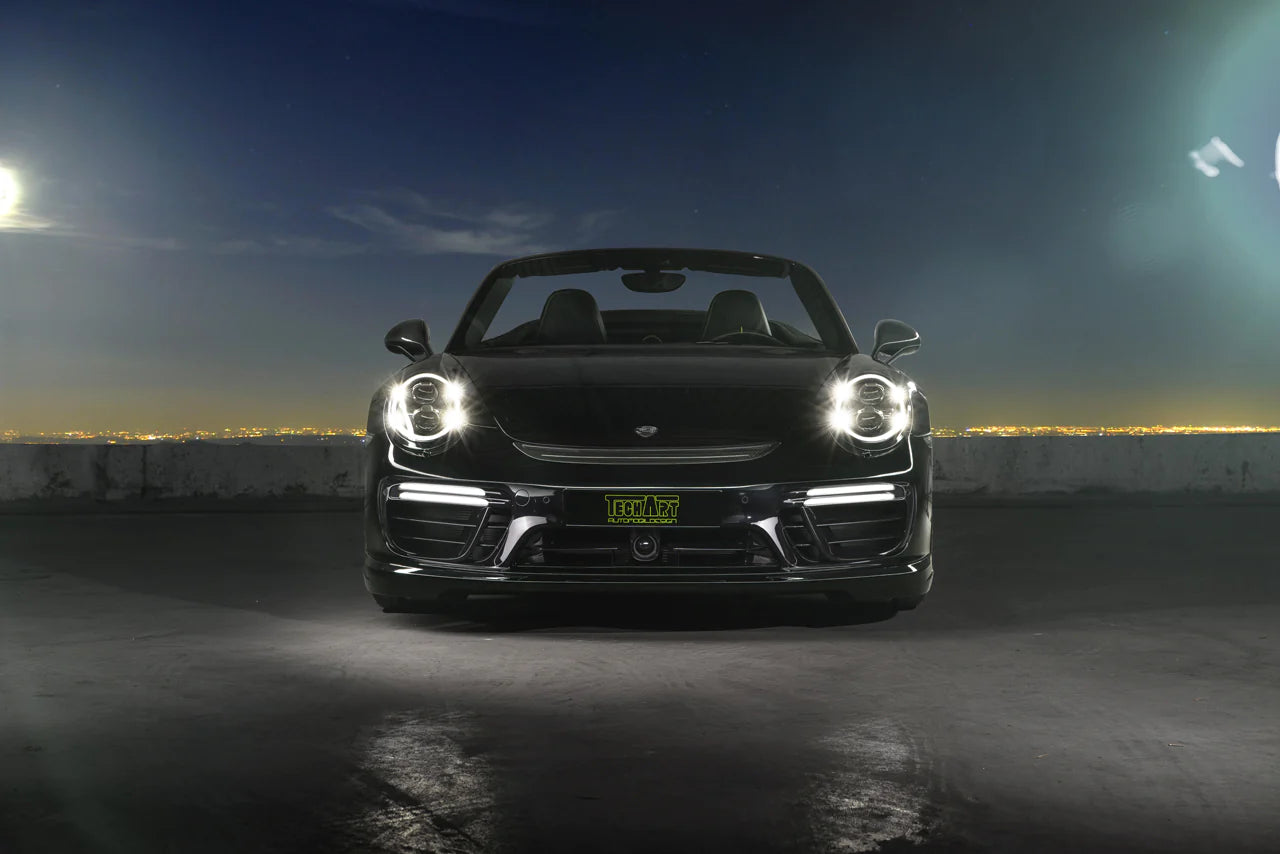 A front view of TECHART Aero Wings for Porsche 991.2 Turbo from MY17 fitted on a black Porsche