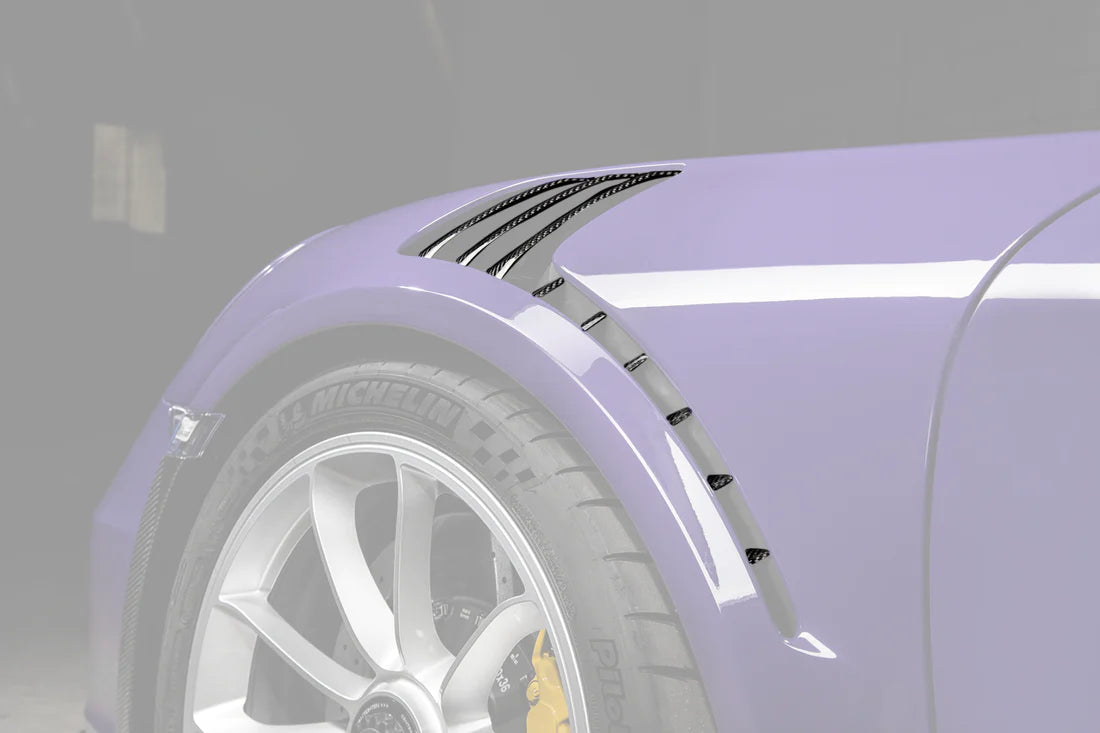 A close up view of TECHART Air Outlet panels in Carbon "glossy" for Porsche 991.1 GT3 RS fitted on a purple Porsche with the panels highlighted