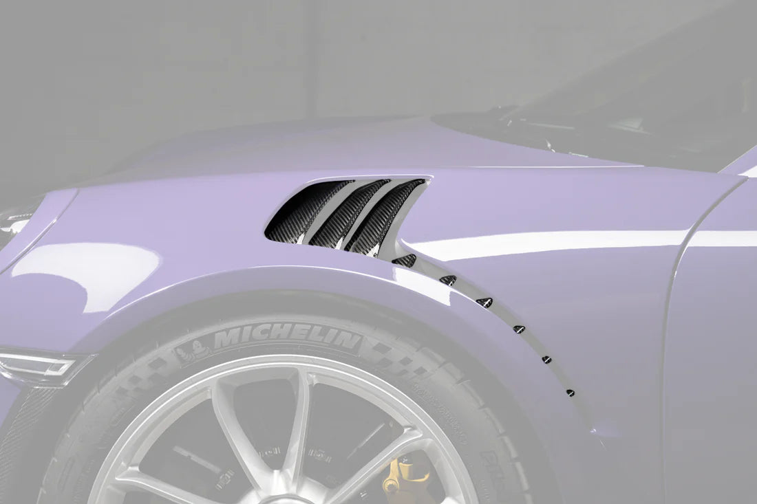 A side view of TECHART Air Outlet panels in Carbon "glossy" for Porsche 991.1 GT3 RS fitted on a purple Porsche with the panels highlighted
