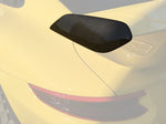 A close up view of TECHART Rear Spoiler Panels Carbon "glossy" for Porsche 991.2 GT3 from MY17 fitted on a yellow car with the spoiler highlighted