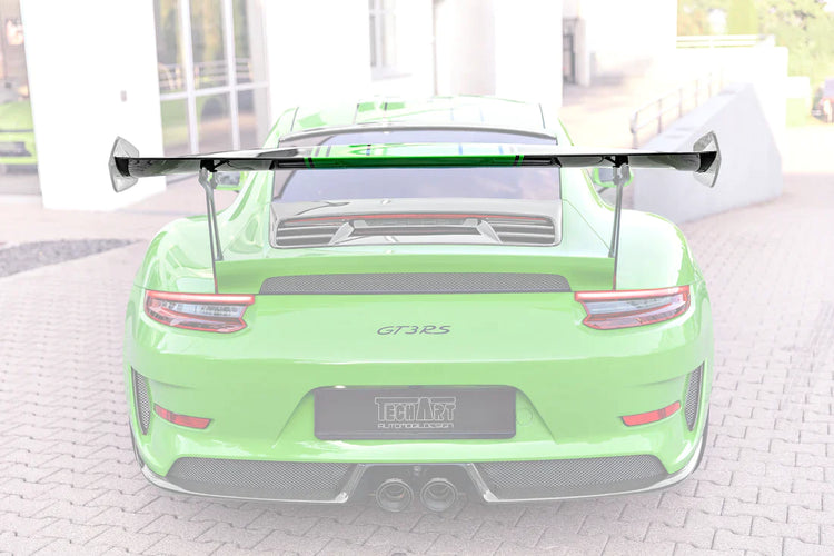 A wide back view of TECHART Rear Spoiler Profile Carbon "glossy" for Porsche 991 GT3 RS fitted on a green car with the spoiler highlighted