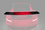 A wide view from the back of TECHART Rear Spoiler Profile Carbon "glossy" for Porsche 991.2 GT3 from MY17 fitted on a red Porsche with the profile highlighted