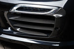 A close up view of TECHART Carbon Grille Trim Bar, "glossy" for Porsche 991.1 Turbo S up to MY16 fitted on a black Porsche