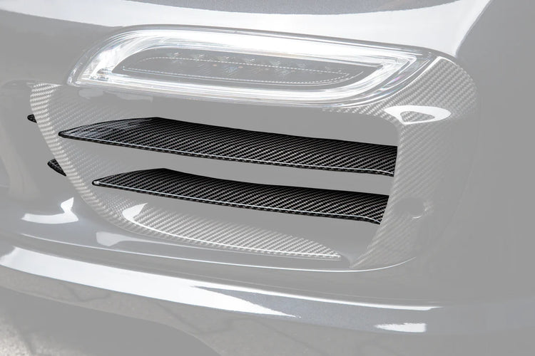 A close up view of TECHART Carbon Grille Trim Bar, "glossy" for Porsche 991.1 Turbo S up to MY16 fitted on a black Porsche with the Grille highlighted