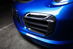 A close up view of TECHART Carbon Grille Trim Bar, "matte" for Porsche 991.1 Turbo S up to MY16 fitted on a blue Porsche