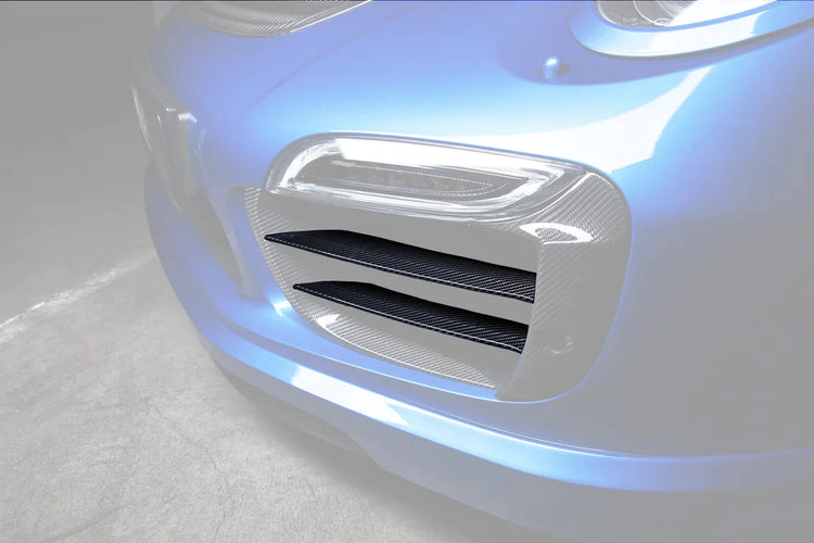 A close up view of TECHART Carbon Grille Trim Bar, "matte" for Porsche 991.1 Turbo S up to MY16 fitted on a blue Porsche with the Grille highlighted