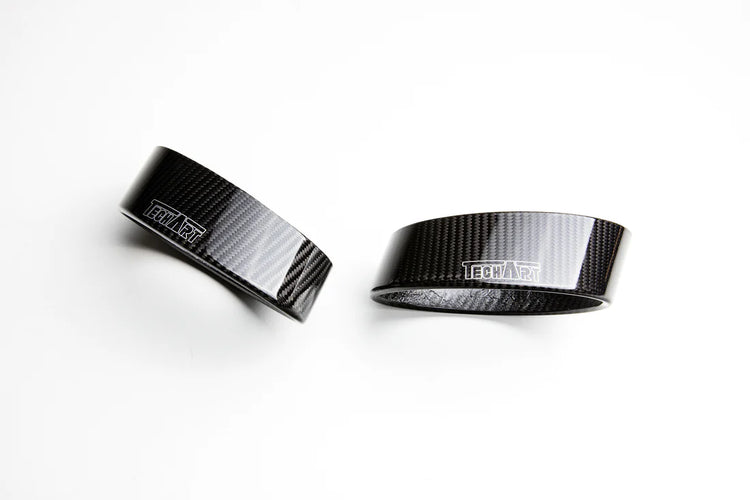 A top view of TECHART Tail Pipe Kit Carbon Glossy for Porsche 992 Carrera / Turbo with Sport exhaust unit with a white background
