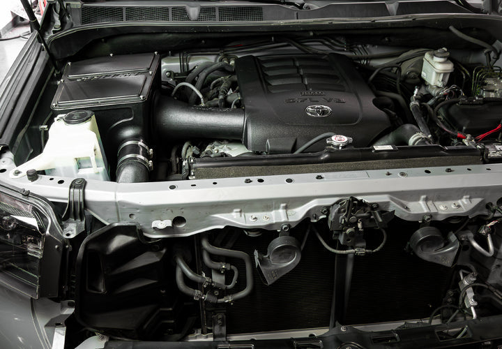 Wide view of Stillen Trupower Cold Air Intake w/ Rain Guard/Oiled Filter Toyota Tundra 2014-2020 fitted inside a car