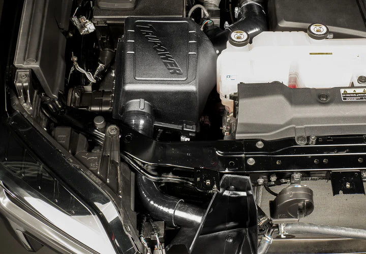 Wide view of Stillen Trupower Cold Air Intake Oiled Filter Toyota Tundra 2022-2025 fitted inside a car