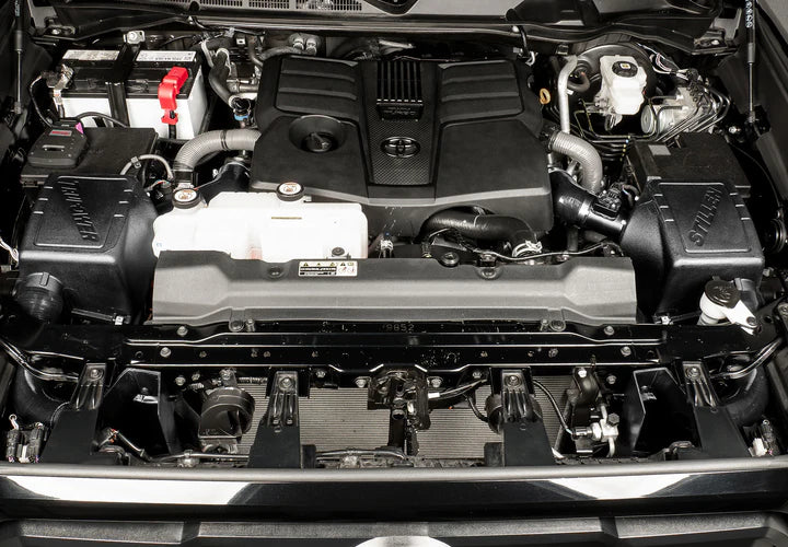 Wide view of Stillen Trupower Cold Air Intake Dry Filter Toyota Tundra 2022-2025  fitted inside a car
