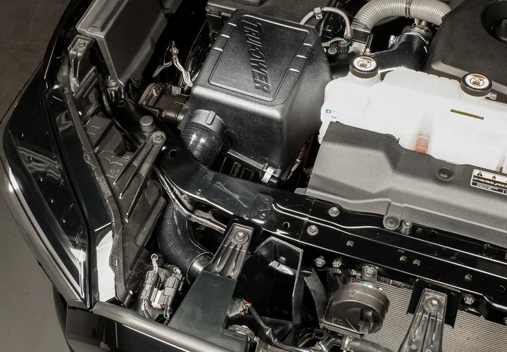 Wide view of Stillen Trupower Cold Air Intake Dry Filter Toyota Tundra 2022-2025  fitted inside a car
