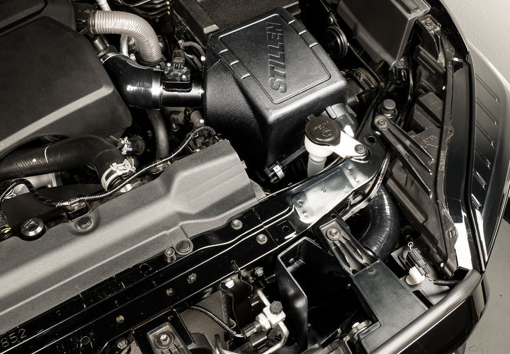 Close view of Stillen Trupower Cold Air Intake Dry Filter Toyota Tundra 2022-2025  fitted inside a car
