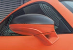 A close up view of TECHART Side Mirror Trims Carbon Glossy Porsche 718 Cayman / Boxster