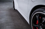 A close up side view of TECHART Side Skirts Porsche 991 Carrera 4 / Targa 4 / GT3 fitted on a white car