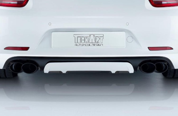 A close up view of TECHART Rear Diffuser Add-on Porsche 991.2 Carrera / Targa fitted on a white Porsche