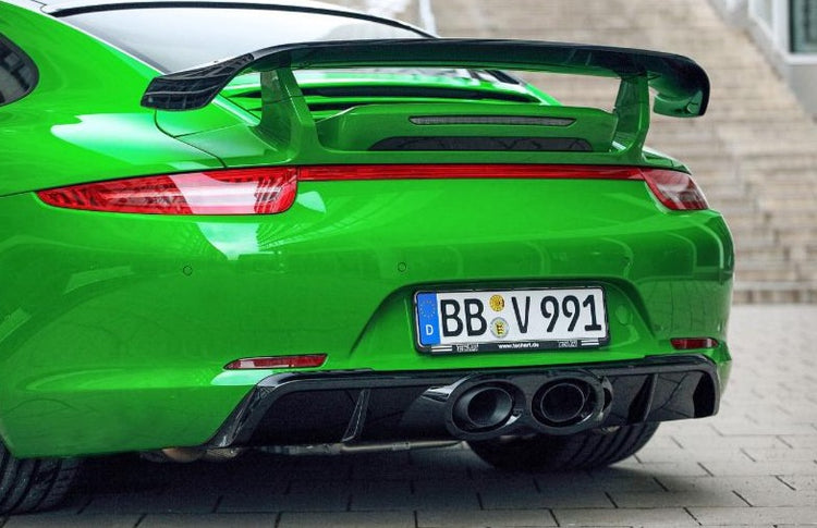 A back view of TECHART Rear Spoiler II Porsche 991 Turbo / S fitted on a green car