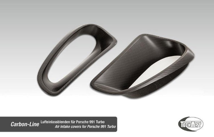 A front view of TECHART Rear Fender Vents Matt Carbon Fiber Porsche 991 GT3 RS / Turbo S with grey background