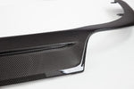 A close up view of TECHART Original Rear Diffuser Glossy Carbon Fiber Porsche 991.2 Turbo / S with a white background