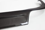 A close up view of TECHART Original Rear Diffuser Glossy Carbon Fiber Porsche 991.2 Turbo / S with a white background