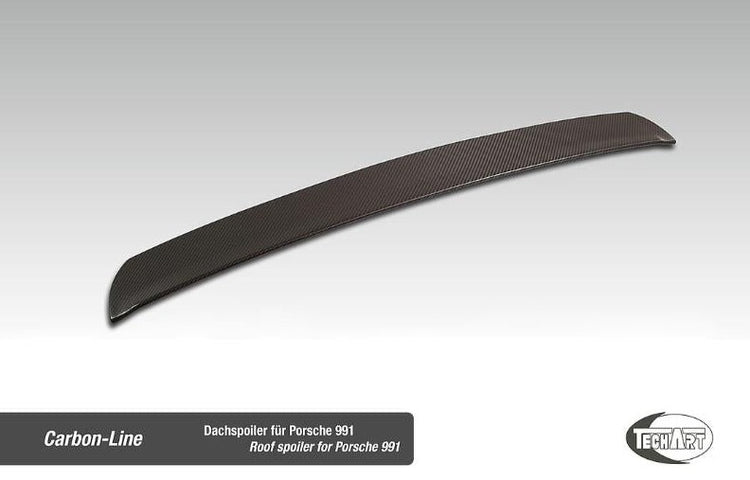 A top view of TECHART Roof Spoiler Matt Carbon Fiber Porsche 991 Carrera / Turbo / GT3 with plain background