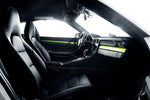 A close up view of TECHART Interior Styling Package I Glossy Carbon Fiber Porsche 991/991.2 Carrera / Targa / Turbo / GT3