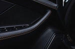 A close up view of TECHART Carbon Interior Kit II Carbon Fiber, Graphite Gray Porsche 718 Cayman / Boxster