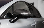 A close up view of TECHART Side Mirror Shells in Glossy Carbon Fiber Porsche 95B Macan