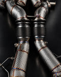 Temerario downpipes from above showing flex bellows and heat-protection wrap