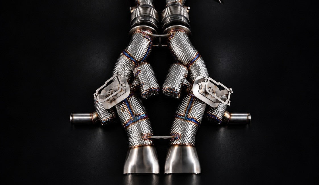 Temerario valved exhaust from above showing valve brackets, heat jackets and twin oval outlets
