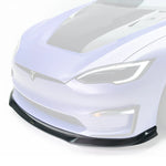 A close up view of a car from the side fitted with Vorsteiner VRS Plaid Aero Front Spoiler Carbon Fiber PP 2x2 Glossy for Tesla Model S 2021+ with a white background with the spoiler highlighted