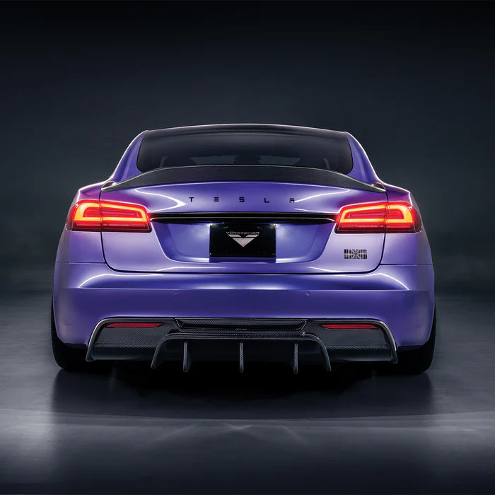 A back wide view of a purple car fitted with Vorsteiner VRS Aero Rear Diffuser Carbon Fiber PP 2x2 Glossy for Tesla Model S 2021+ with grey background