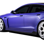A side view of a car fitted with Vorsteiner VRS Plaid Aero Side Skirts Carbon Fiber PP 2x2 Glossy for Tesla Model S 2021+ with white background