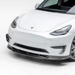 A side close view of Vorsteiner VRS Add-On Aero Bumper Flares Carbon Fiber PP 2x2 Glossy on a white car (for Model Y).