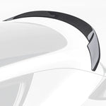 A close up view of Vorsteiner VRS Aero Decklid Spoiler Carbon Fiber PP 2x2 Glossy fitted on a white car (for Model Y).