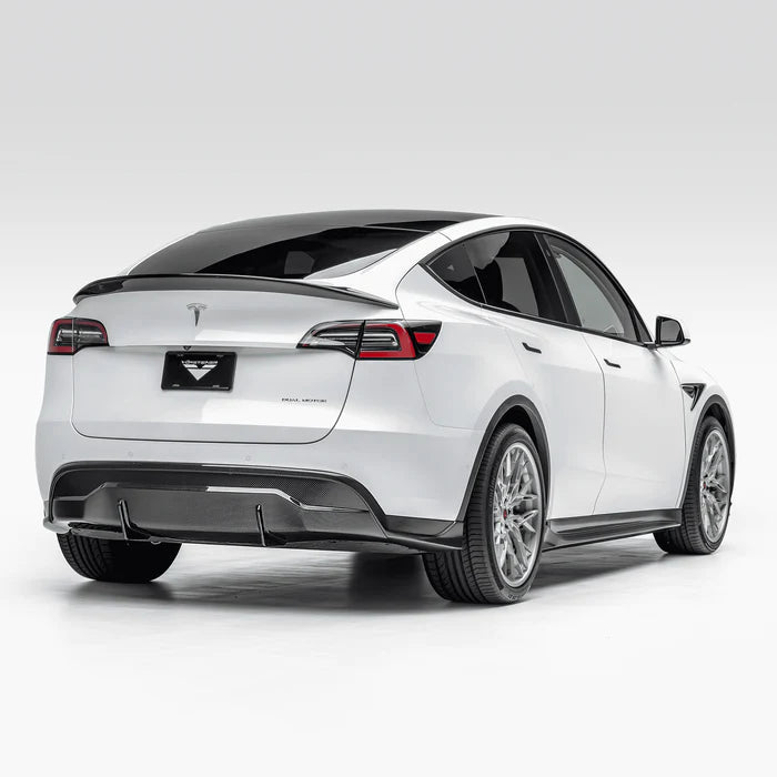 A side wide view of Vorsteiner VRS Aero Decklid Spoiler Carbon Fiber PP 2x2 Glossy fitted on a white car from behind (for Model Y).