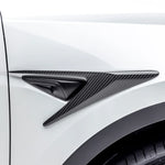 A close up view of Vorsteiner VRS Add-On Aero Fender Vents Carbon Fiber PP 2x2 Glossy on a white car from the side (for Model Y). 