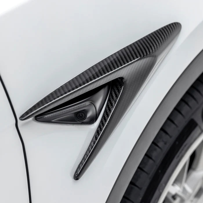A side close up view of Vorsteiner VRS Add-On Aero Fender Vents Carbon Fiber PP 2x2 Glossy on a white car (for Model Y). 
