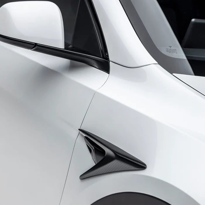 A side close up view of Vorsteiner VRS Add-On Aero Fender Vents Carbon Fiber PP 2x2 Glossy on a white car (for Model Y). 