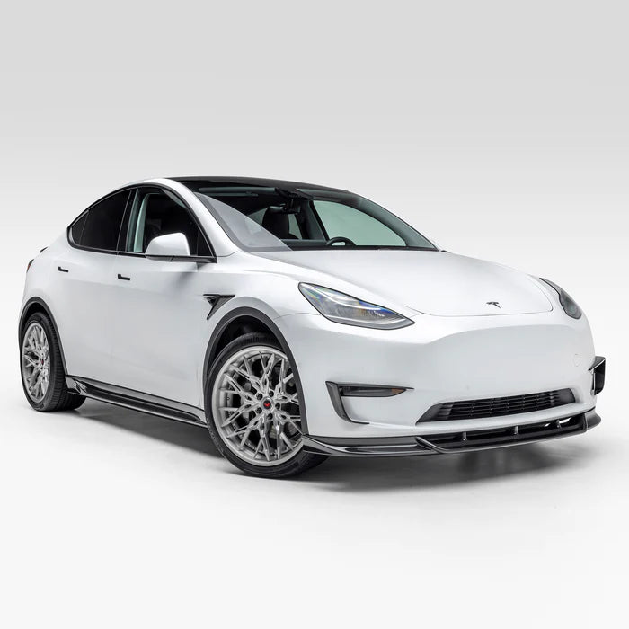 A wide view of Vorsteiner VRS Add-On Aero Fender Vents Carbon Fiber PP 2x2 Glossy on a white car (for Model Y). 